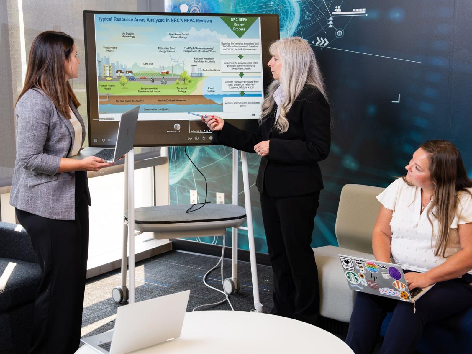 PNNL researchers conversing