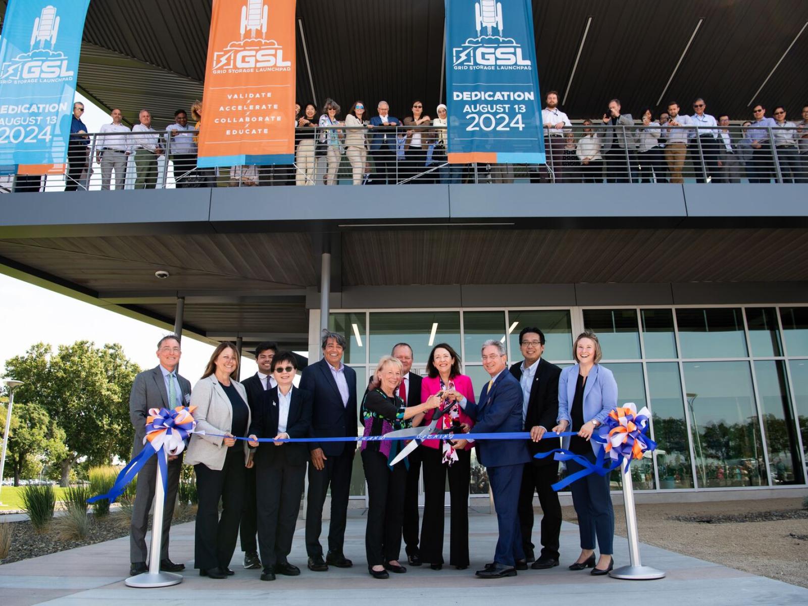 Leaders gather to cut the ribbon at the GSL Dedication.