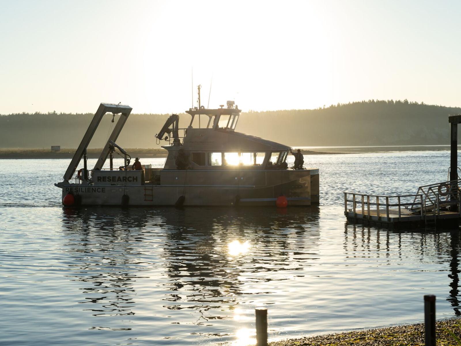 The RV Resilience arrives at the PNNL-Sequim dock with the sun shining through the windows.