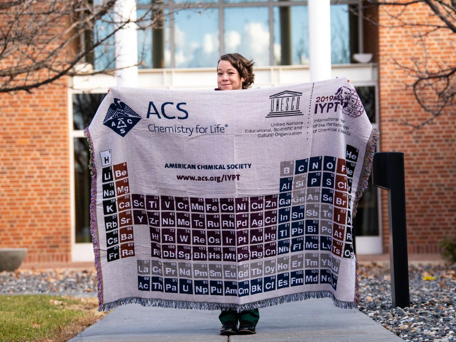Palazzo holding a blanket showing the periodic table of the elements