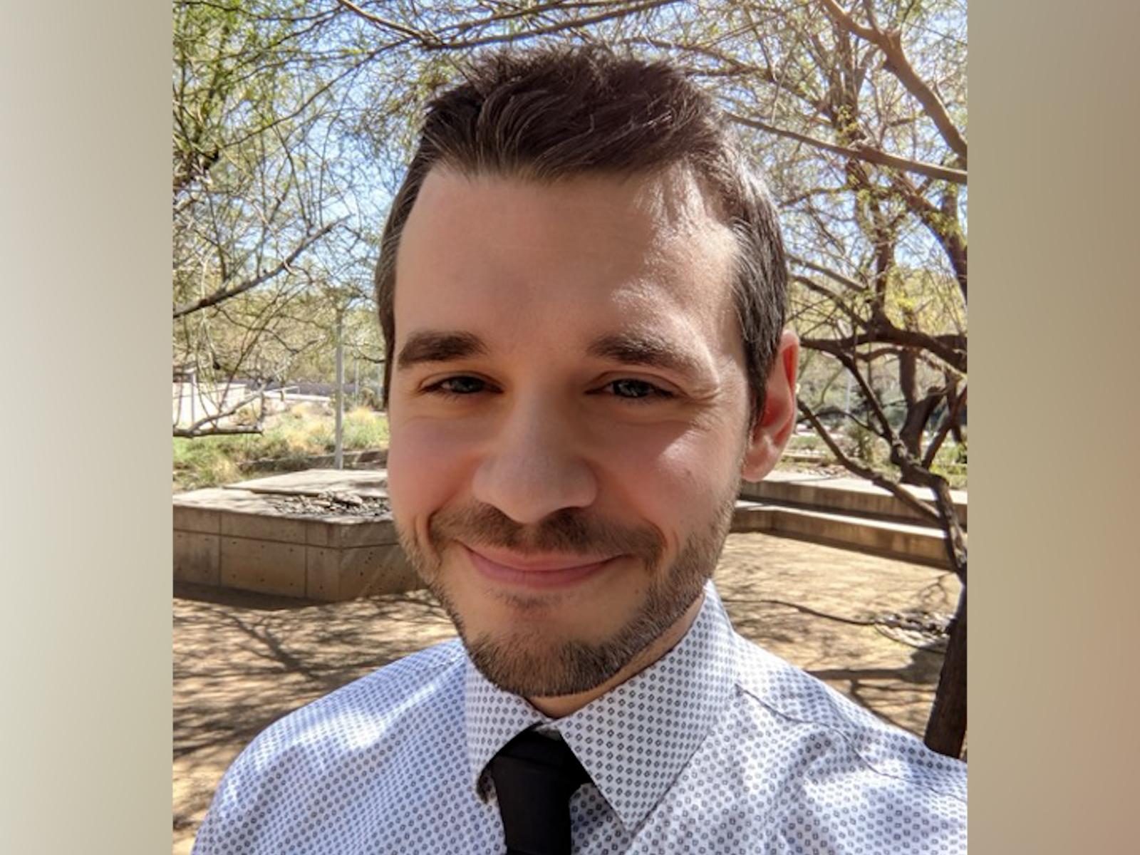 Man in white shirt and black tie