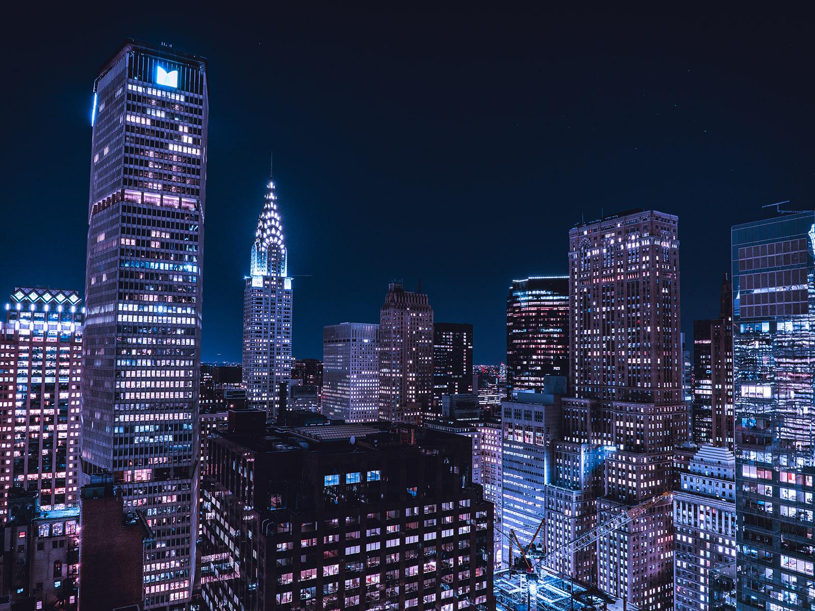 Buildings in New York City lit up at night