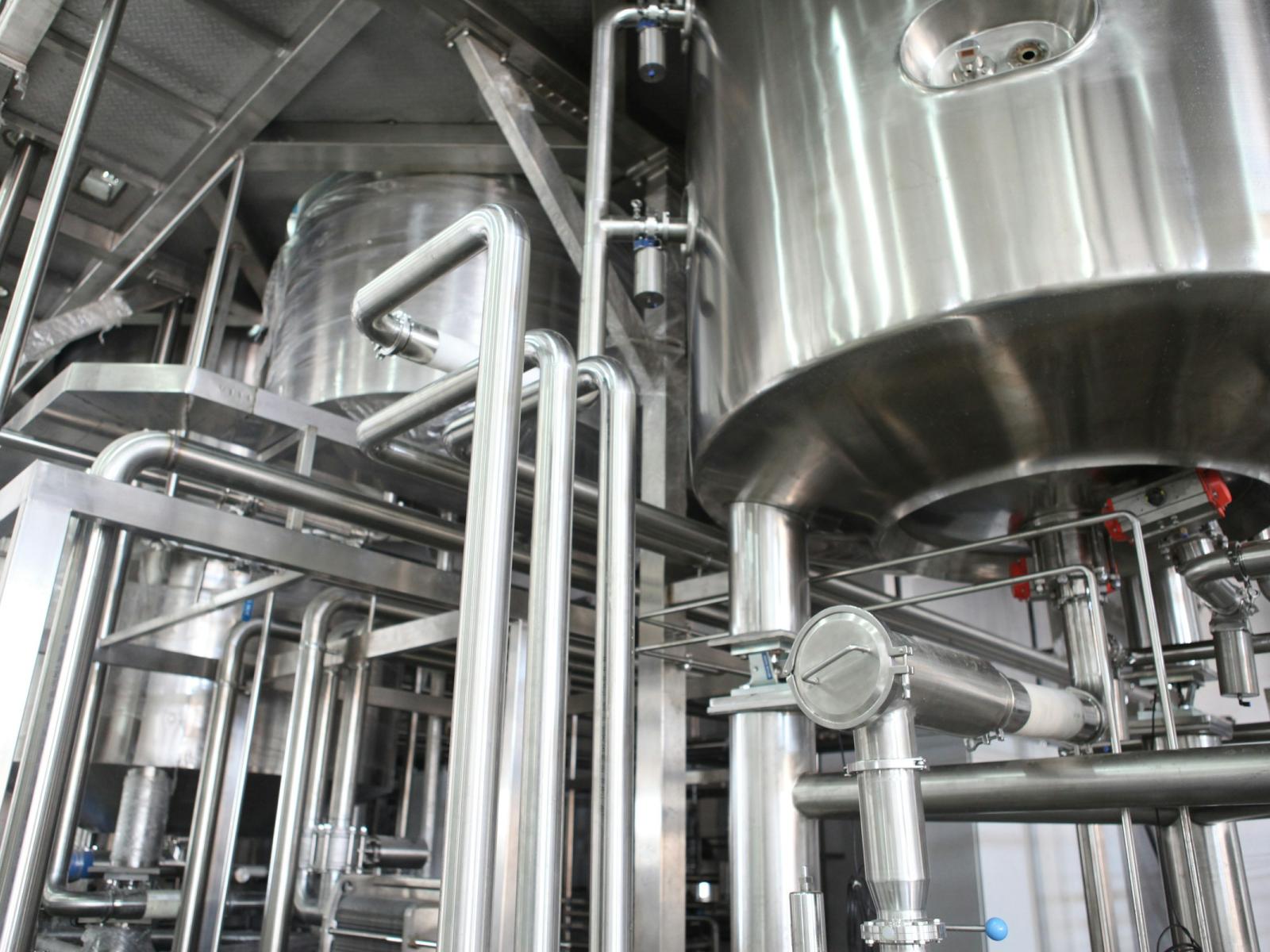 The image shows large metal hardware in a laboratory.