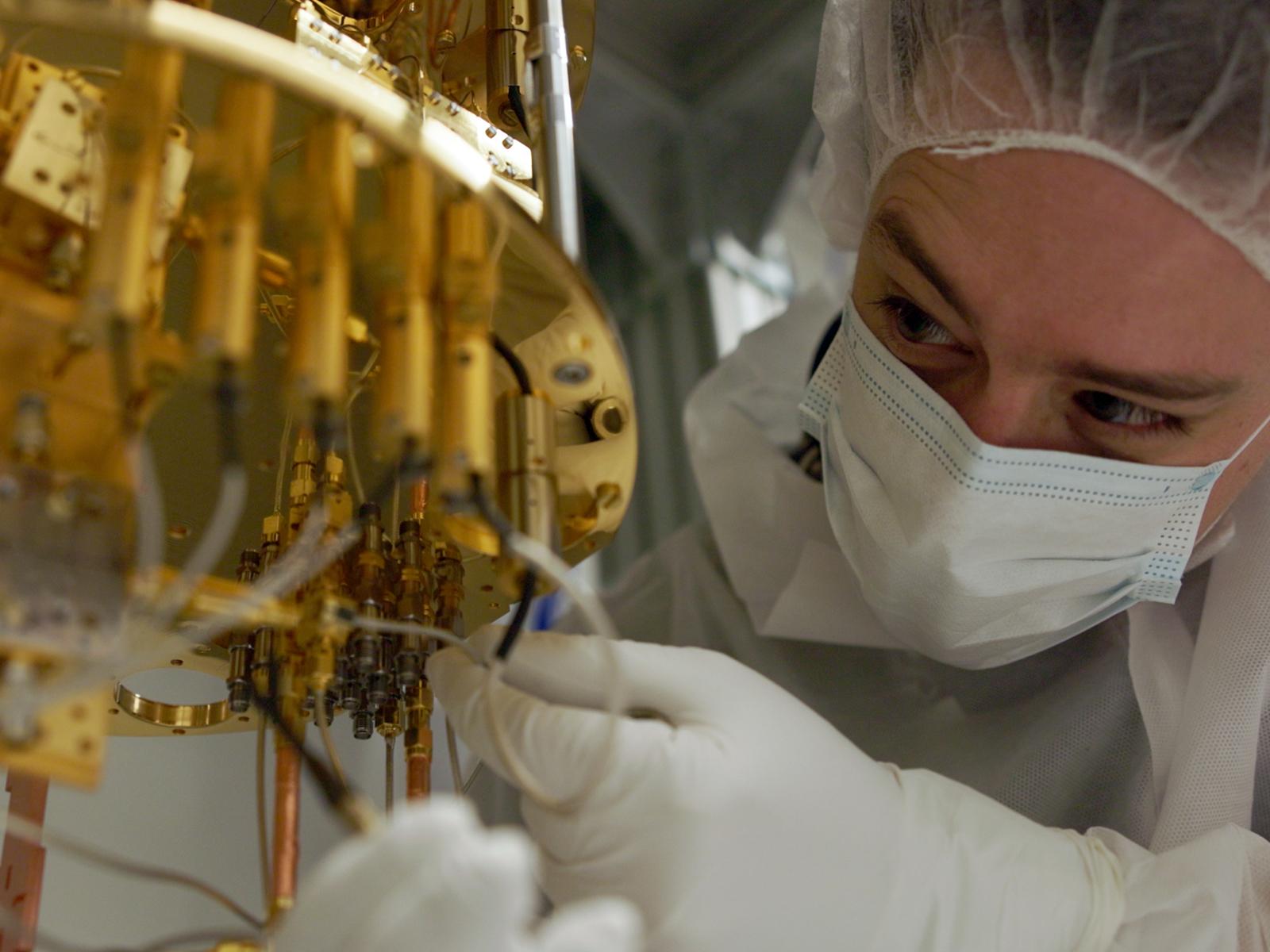 A man working with equipment in a laboratory
