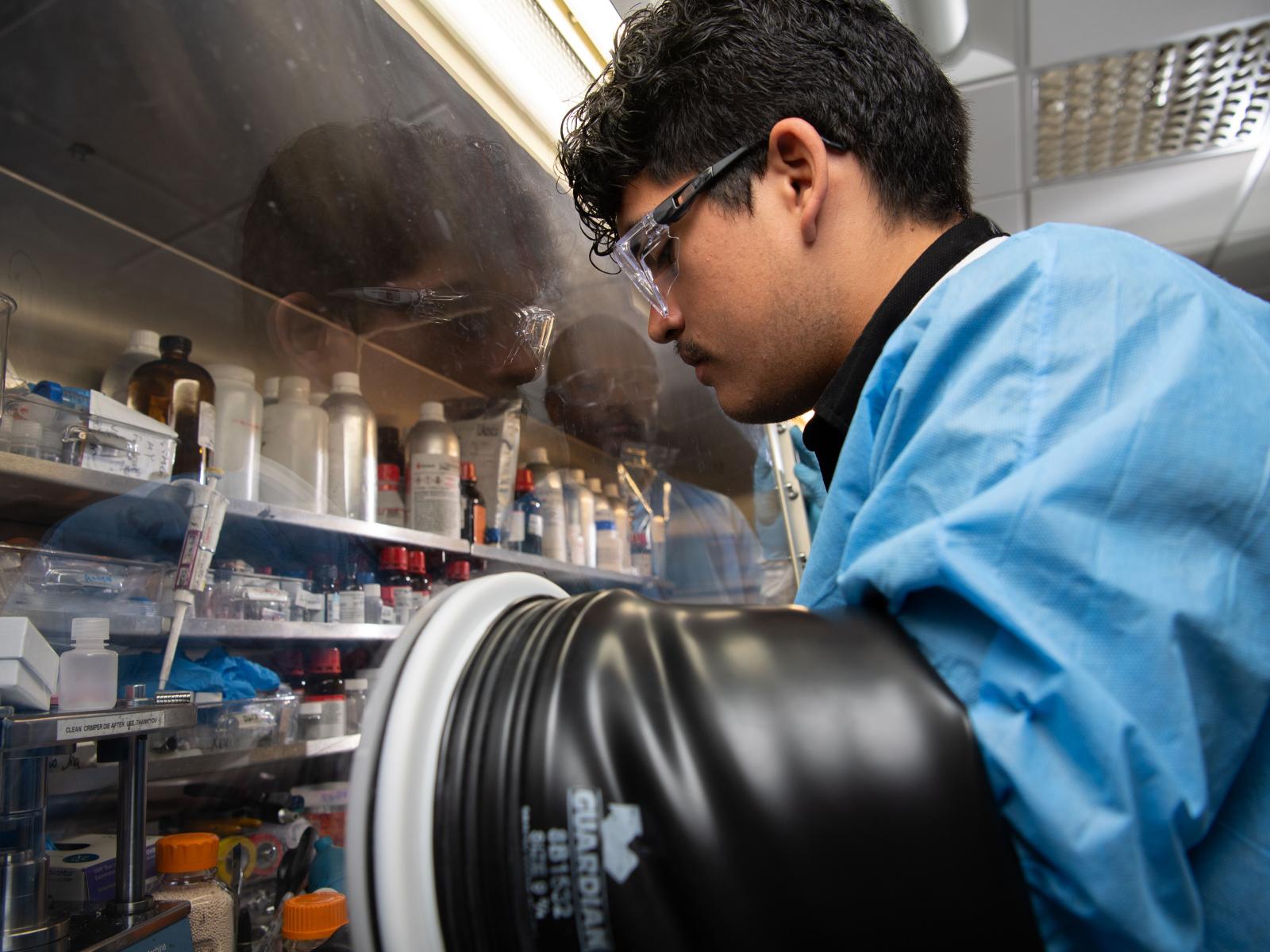 Ricardo Sandoval, dressed in full lab safety gear.