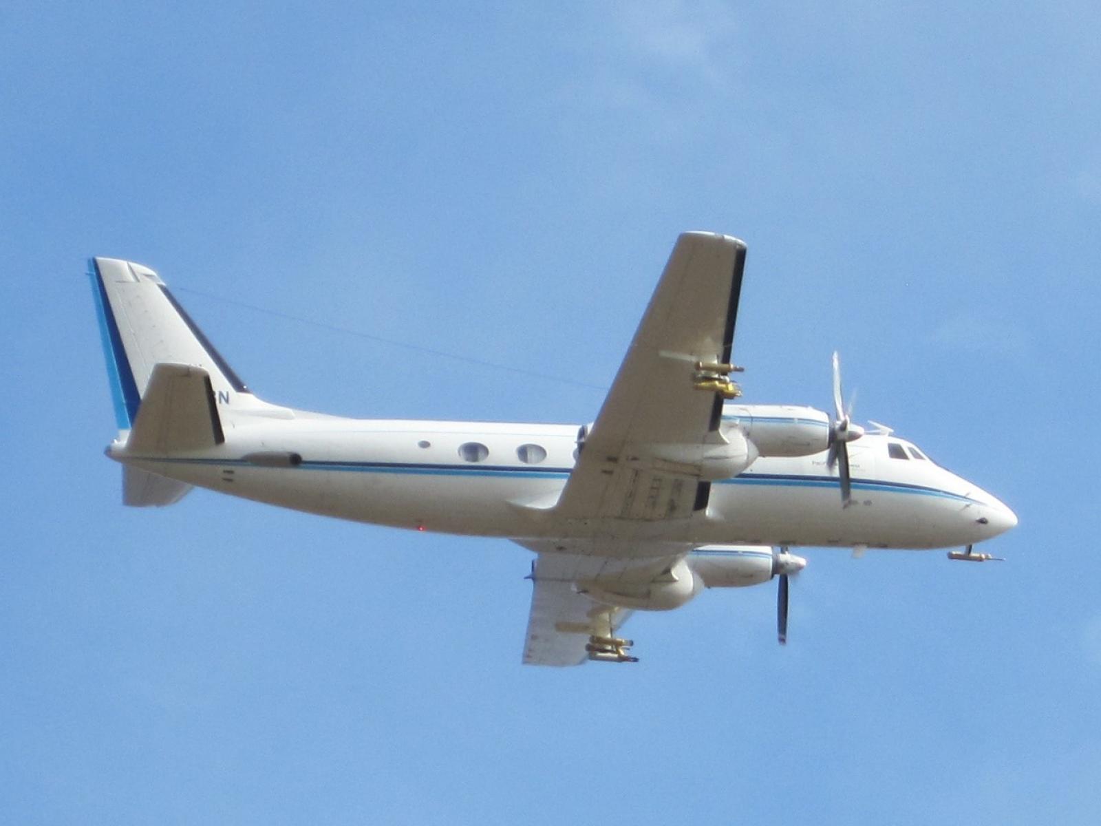 Small airplane on a bright blue sky