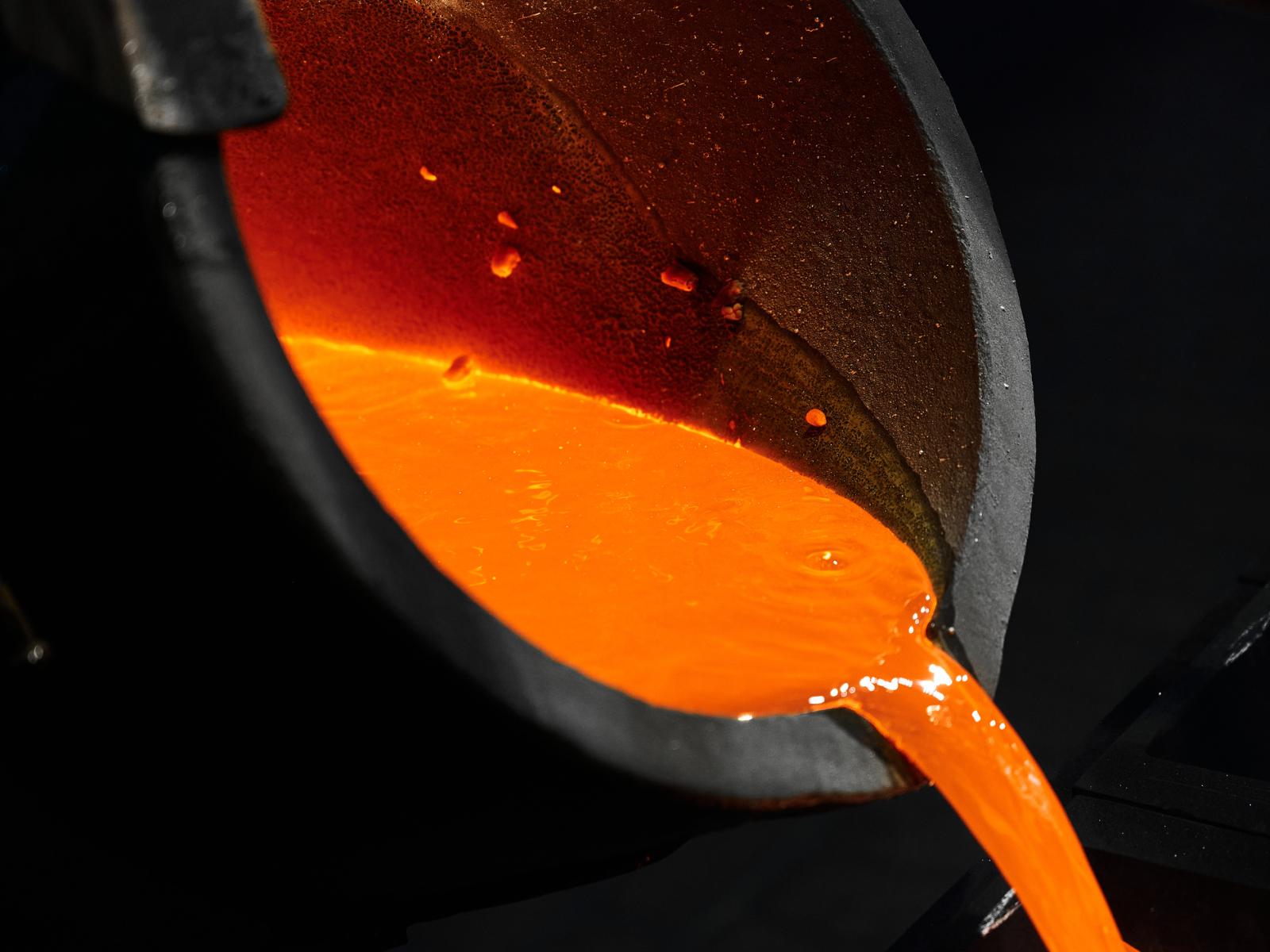 Photo of pouring red liquid silver metal