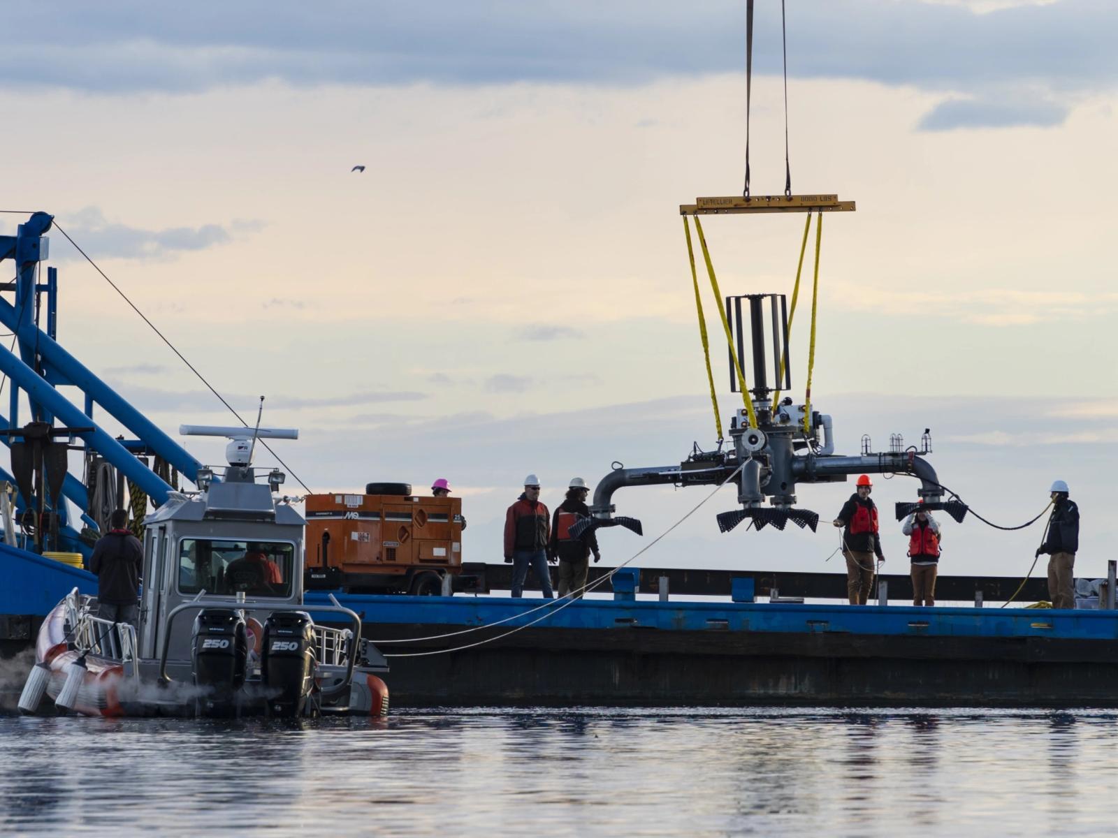 A novel cross-flow tidal turbine and custom environmental sensor package designed by University of Washington Applied Physics Laboratory was deployed in Sequim Bay for testing by PNNL.