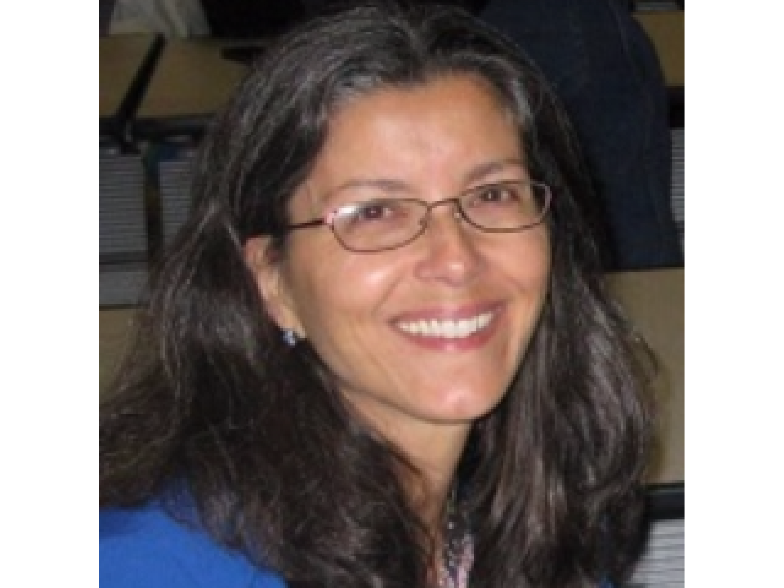 Photo of a woman wearing glasses. 
