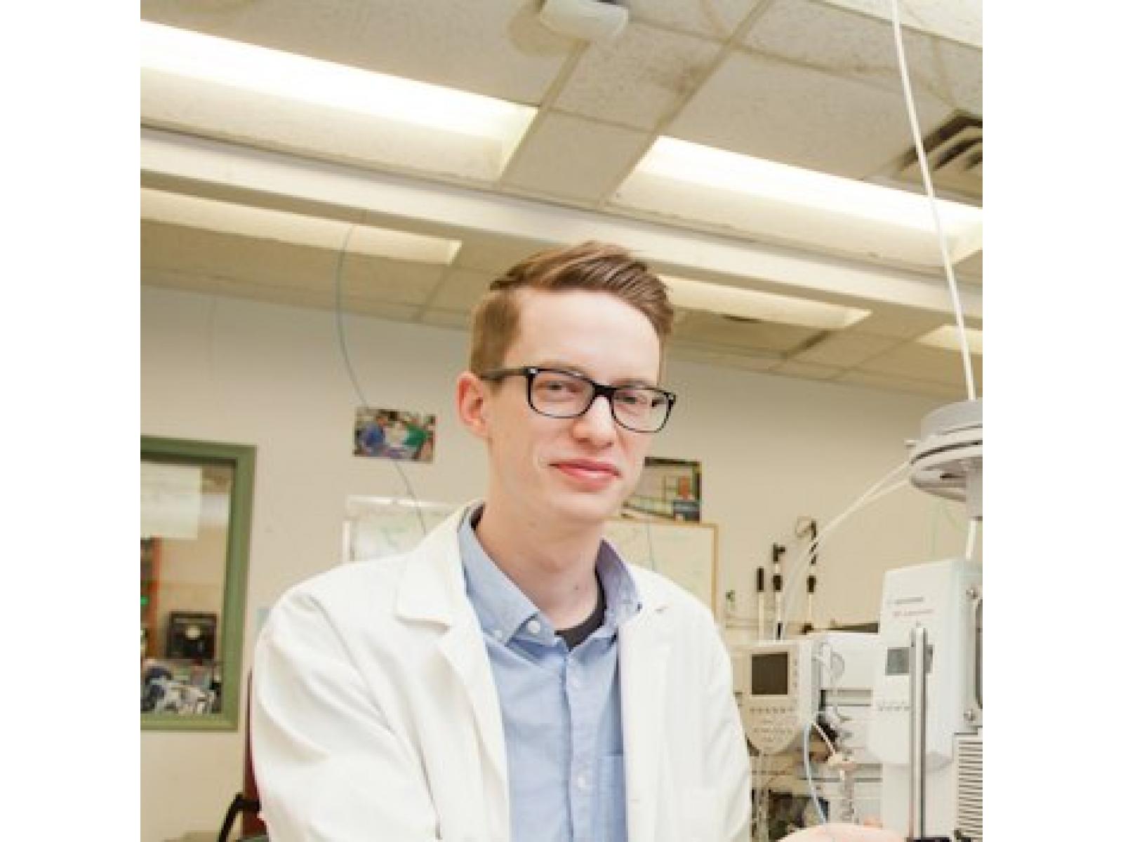 man with glasses and lab coat