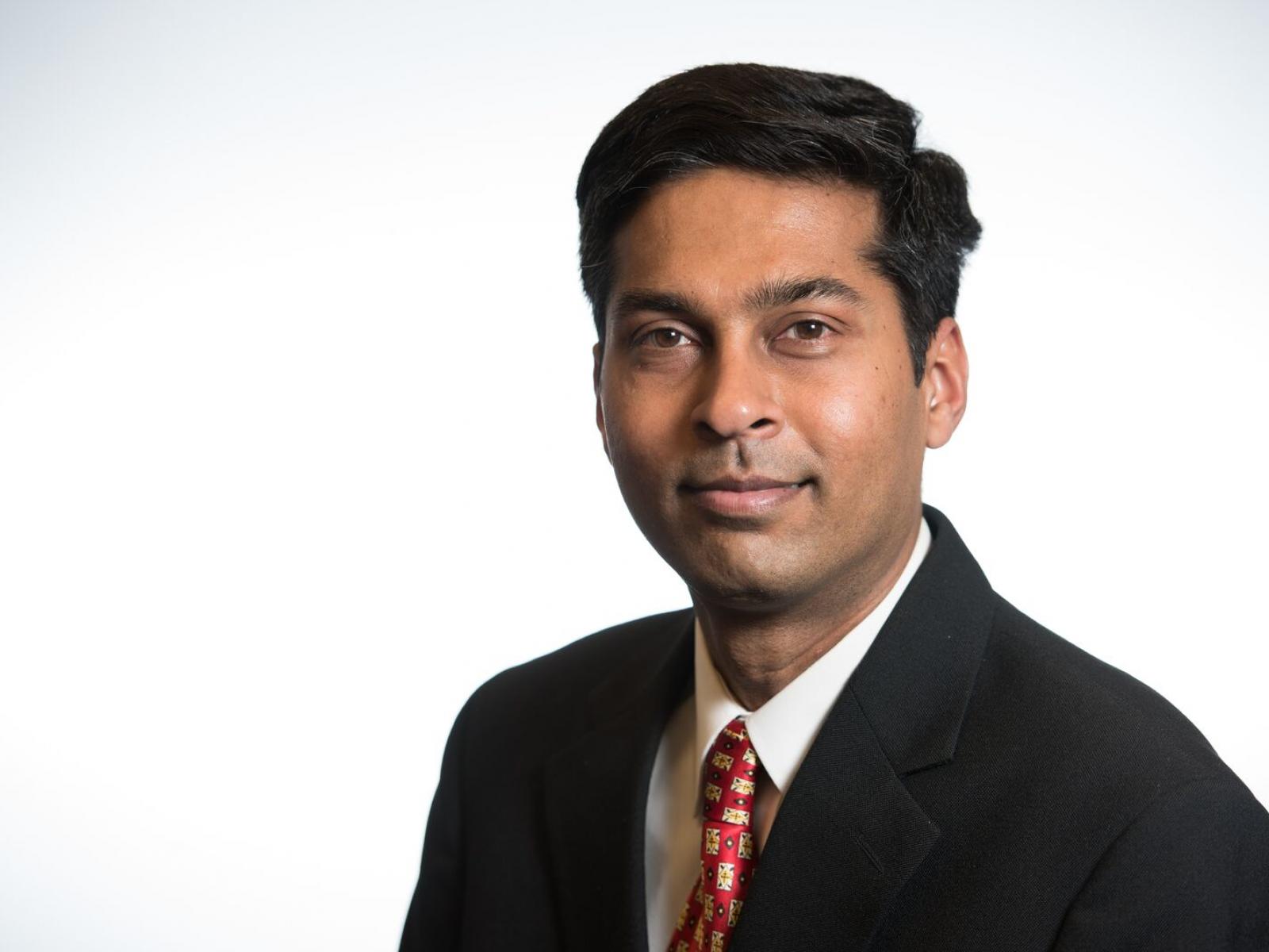 Photo of a man in a suit. 