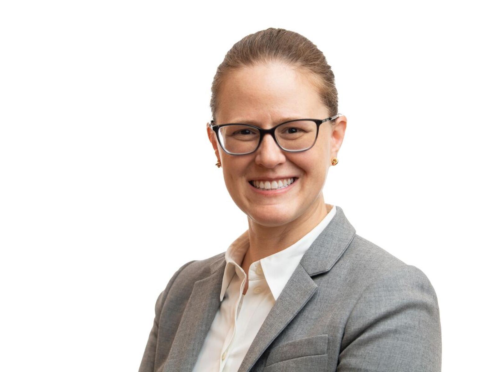 woman with glasses smiling