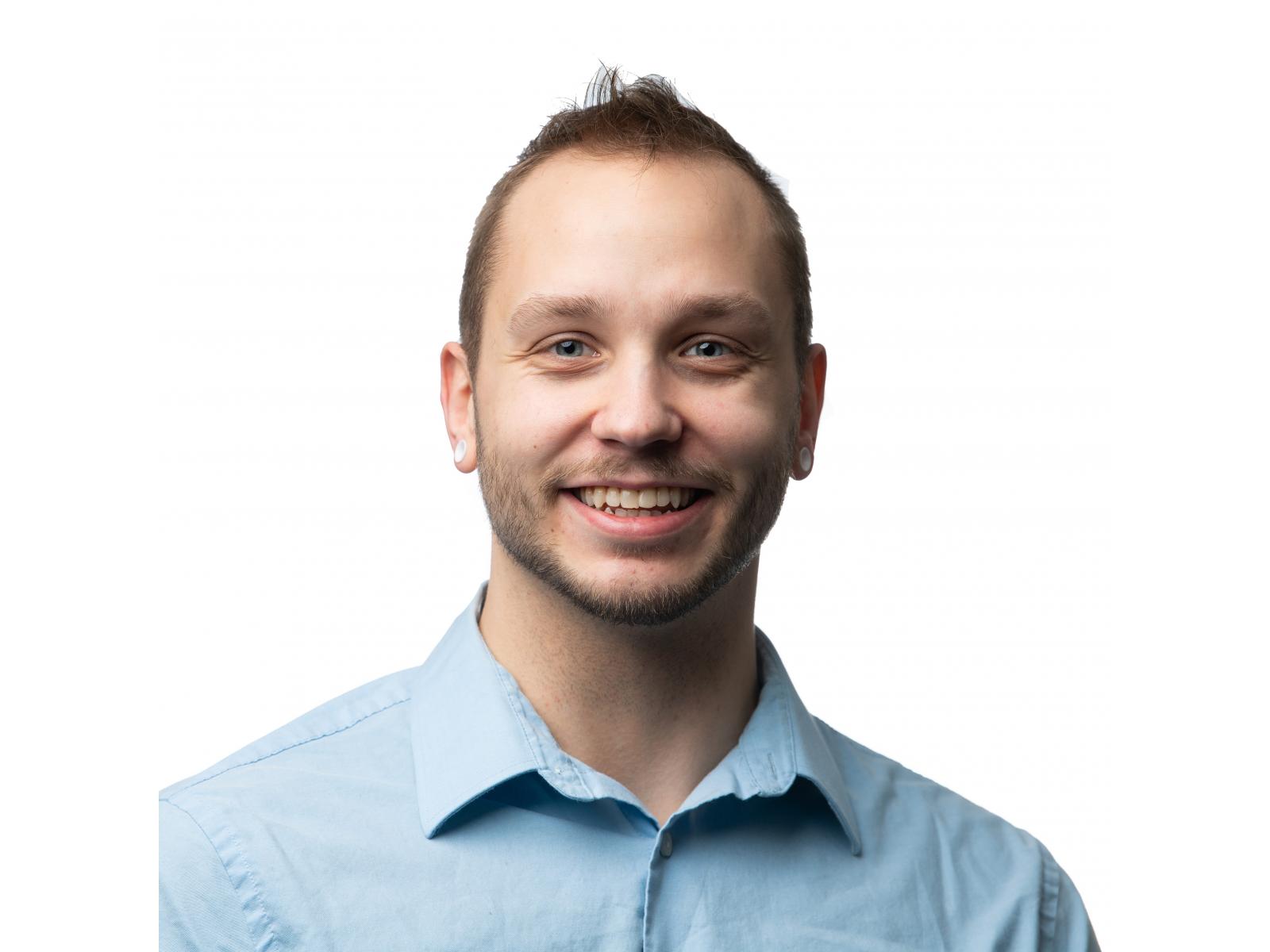 photo of man in light blue button down shirt