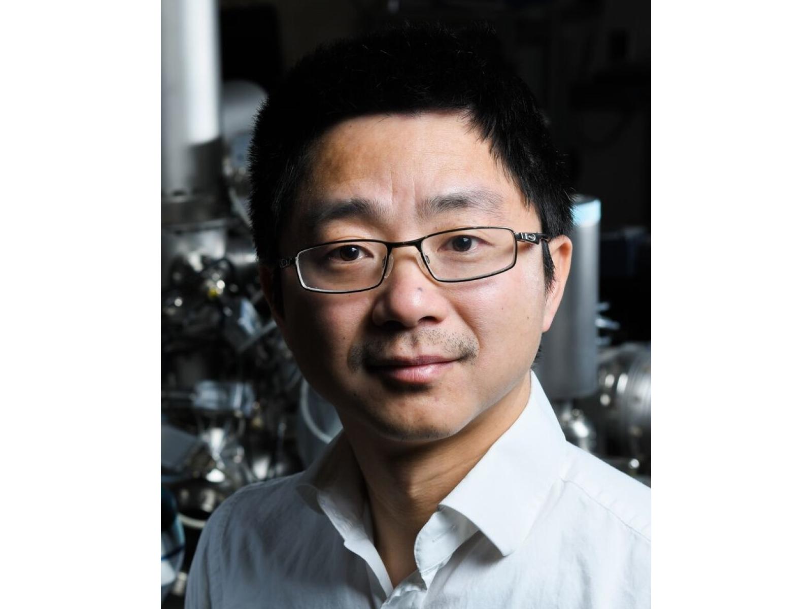 Man wearing glasses and a collared shirt.