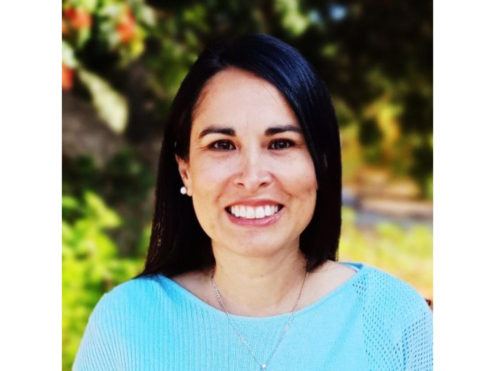 Photo of PNNL researcher Angela Cintolesi smiling at the camera.