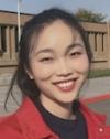 Yatong Zhao is a PhD intern with the IDREAM EFRC. She is standing outside and wearing a red jacket.