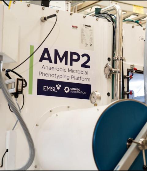 The exterior of a machine with "AMP2: Anaerobic Microbial Phenotyping platform" written on it.