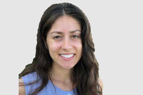 Headshot of Anastasia Bernat with a light gray background