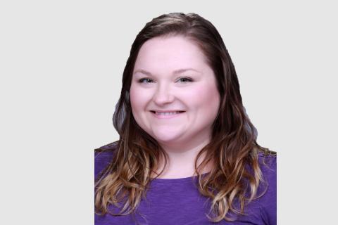 Headshot of Sadie Montgomery with a light gray background