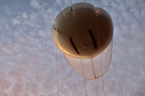 Tethered balloon system taking flight. 