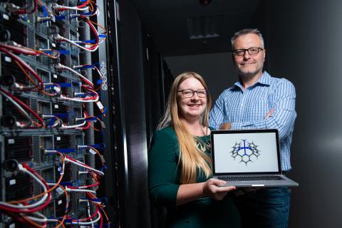 PNNL researchers Samantha Johnson (left) and Simone Raugei use computational methods to understand and predict new catalysts for producing fuel and harvesting energy. Shown here are molecules that can harvest energy from ammonia. Photo courtesy of Andrea Starr, Pacific Northwest National Laboratory.