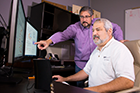 Cybersecurity software developed at Pacific Northwest National Laboratory learns about a company to better protect it. Called CHAMPION, the software can reason like an analyst to determine if network activity is suspicious. It then issues an alert in near-real-time. PNNL Shawn Hampton (left), Champion Technology Company's Ryan Hohimer (right) and their teams received an R&D 100 and FLC Award for developing this technology.