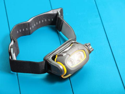 A flashlight with a band so it can be worn around your head.
