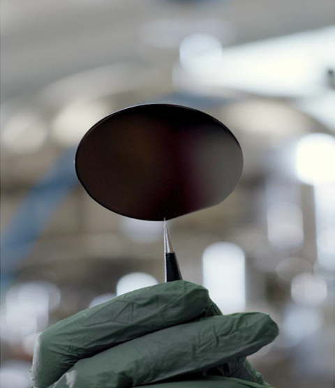 Picture of a thin oxide film being held up via a clasp