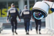 Security guards walking with camera on wall