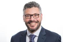 Photo of a man in a suit. 