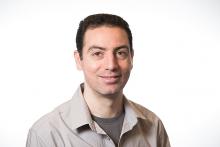 Portrait of male scientist Michel Sassi