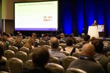Photograph of Mitra Taheri presenting at MRS conference