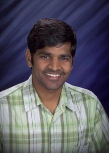Man in green and white shirt with blue background