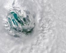 This image depicts the eye of Hurricane Ian. Thick, spinning thunderstorm clouds encircle and form the eye of the storm.