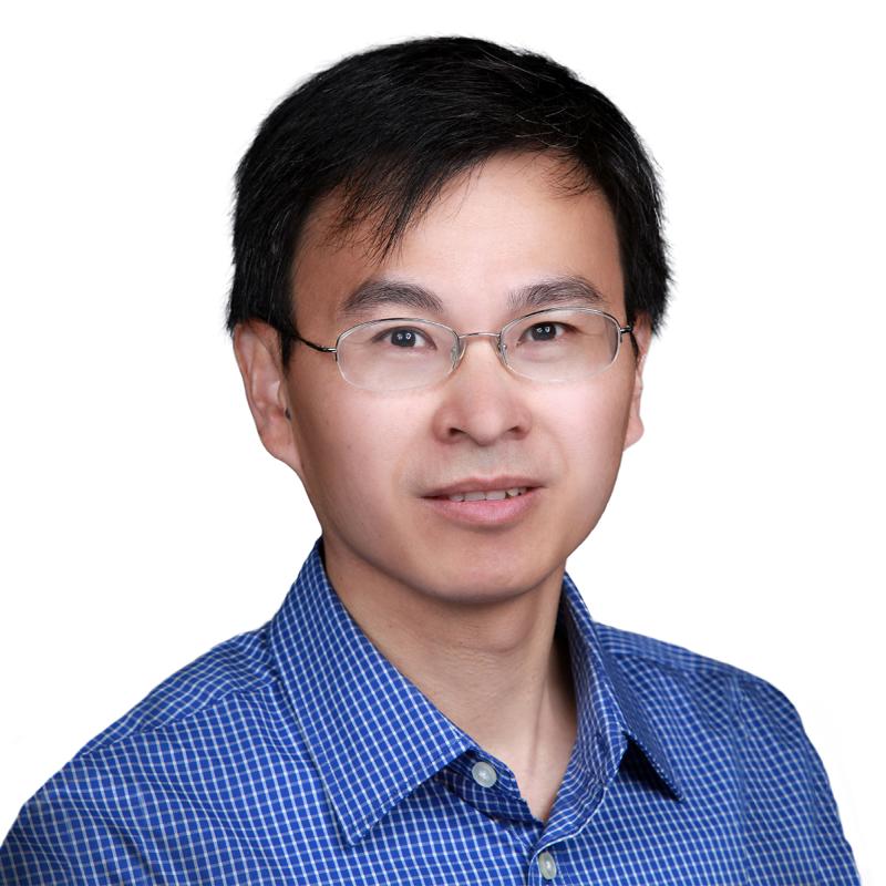 portrait of a man wearing a blue shirt