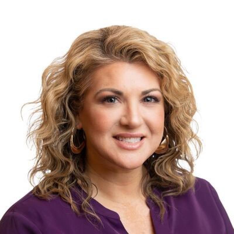 Woman with wavy blonde hair.