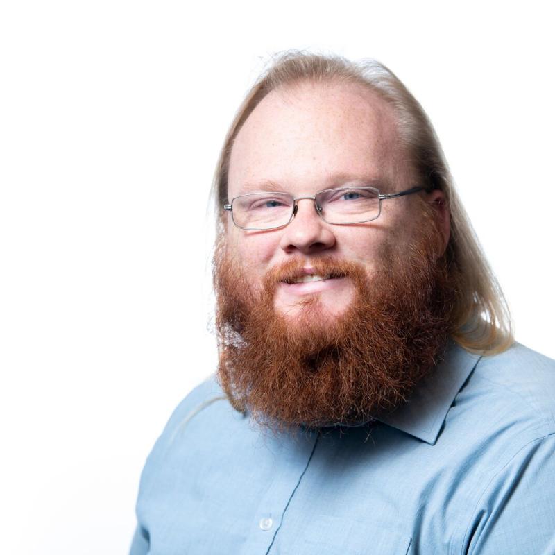 Photo of a man in a blue shirt. 