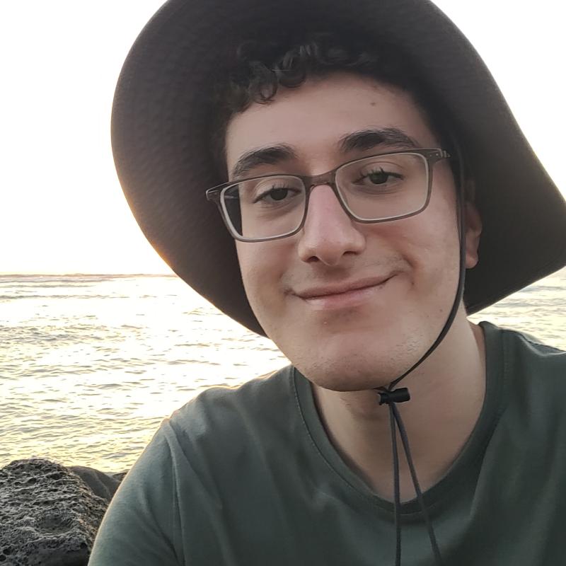 Portrait of Yusuf with water in background 