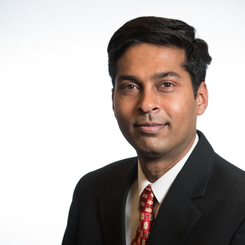 Photo of a man in a suit. 