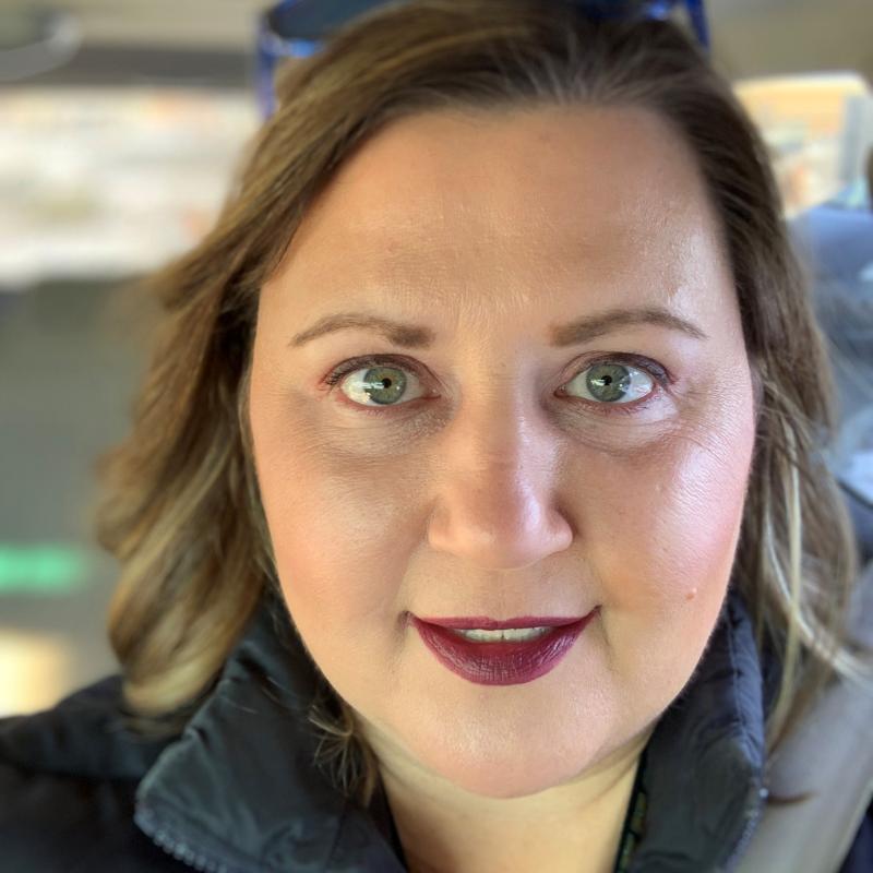 tight focus on Rebecca Redeker smiling toward the camera