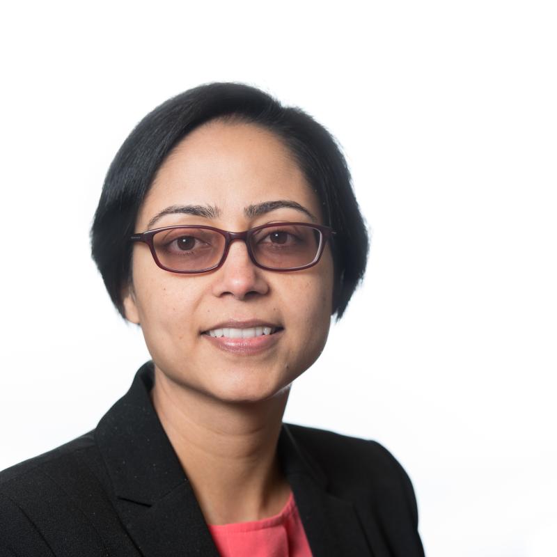 Smiling woman with short hair and glasses