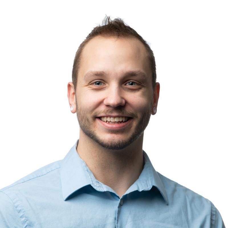 photo of man in light blue button-down shirt