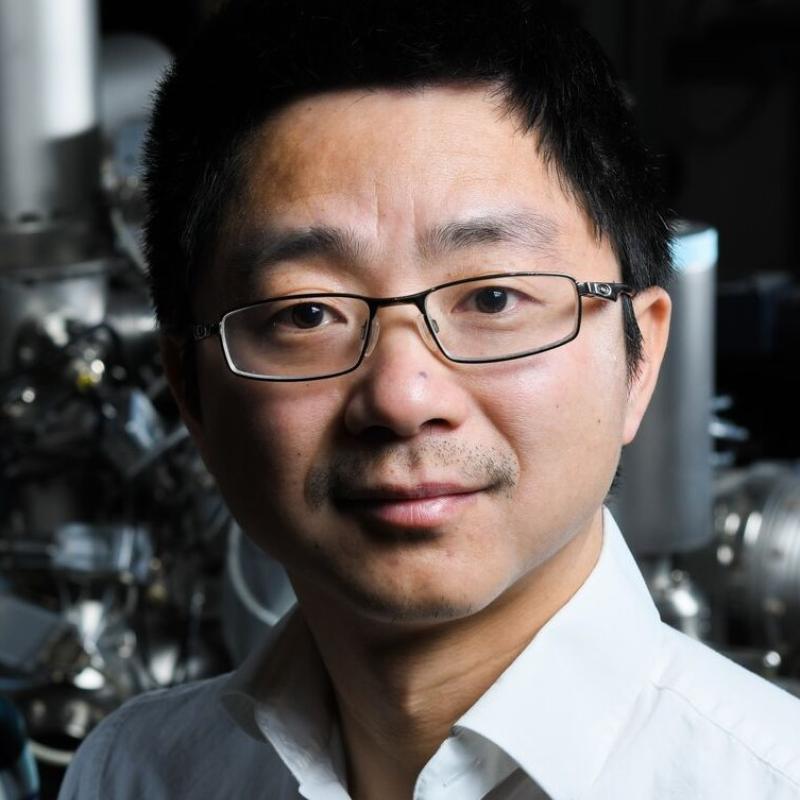 Man wearing glasses and a collared shirt.