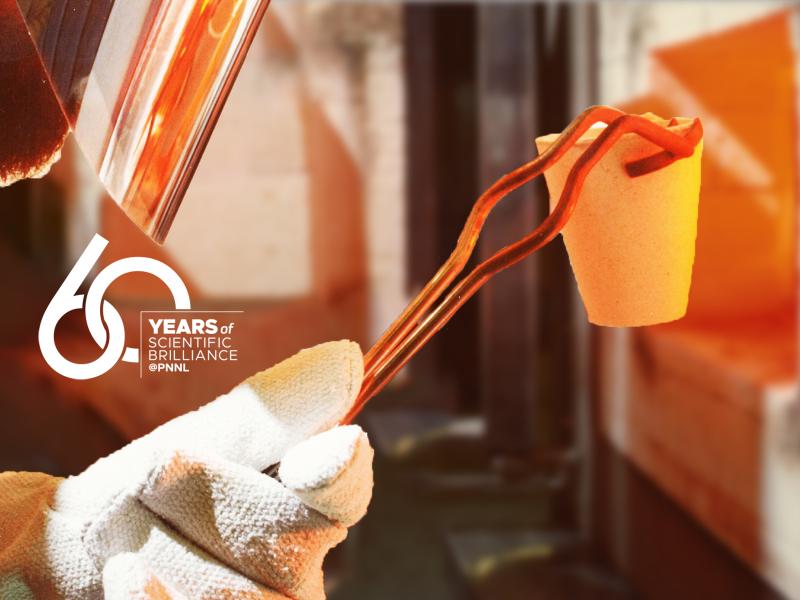 a gloved hand holds a crucible in a pair of tongs