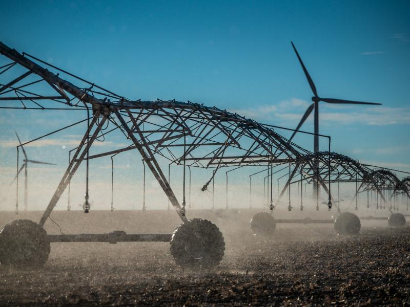 a large irrigation system spraying water over crops