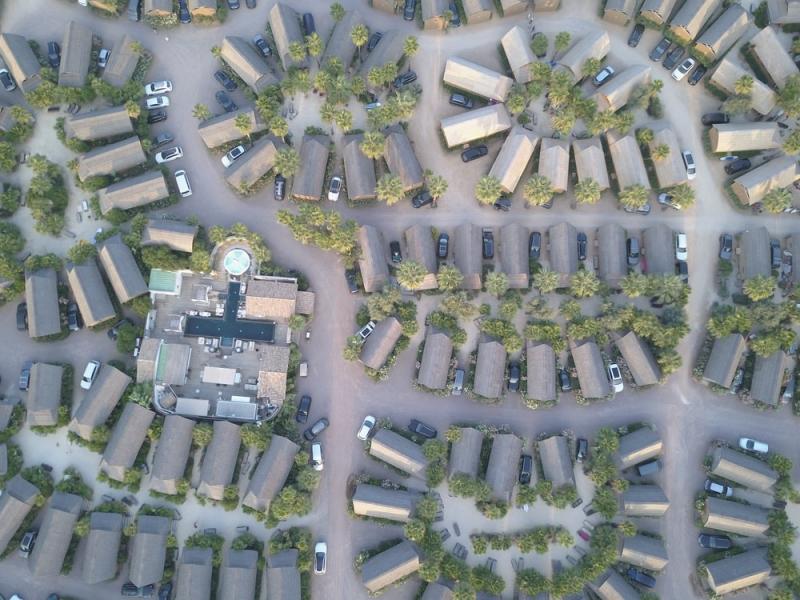 Aerial view of houses and cars in a subdivision