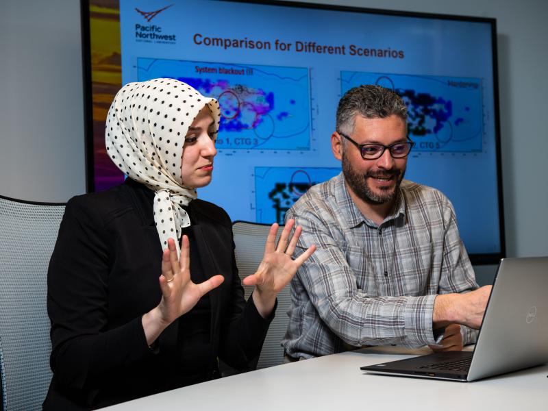 Electrical engineers Sarah Davis and Marcelo Elizondo use the Dynamic Contingency Analysis Tool (DCAT).