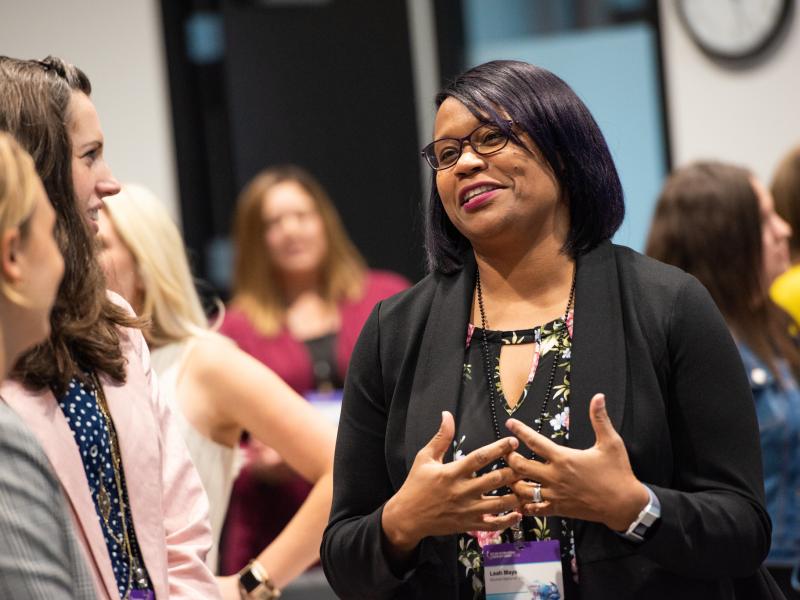 Attendees networking with colleagues at WIE Leadership Summit