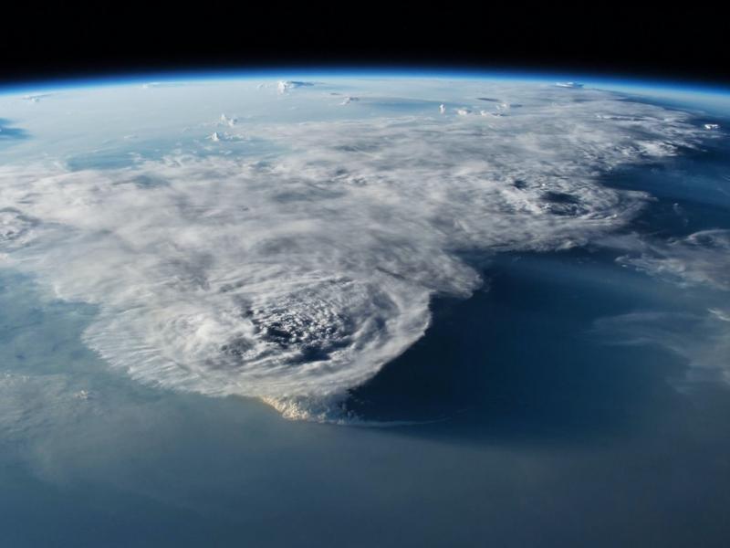 Large storm clouds above the Earth viewed from space
