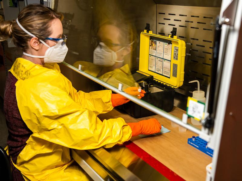 Biomedical scientist Ashley Bradley works in a specialized laboratory measuring substances’ chemical properties. 